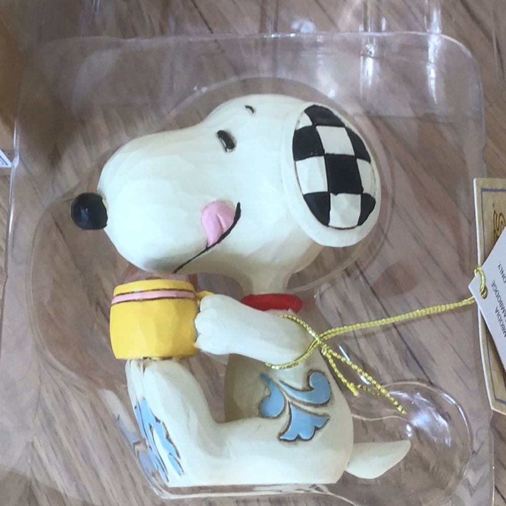 Enesco Peanuts design by Jim Shore. Snoopy Dog Figurine with donut and coffee.